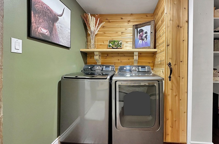 Main floor laundry & custom cabinetry.