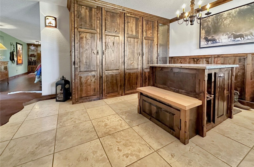 Custom cabinets, tip out storage in island & lockable gun cabinet.