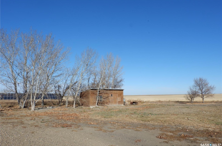 View of yard with an outbuilding and a rural view