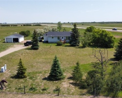 Birds eye view of property with a rural view