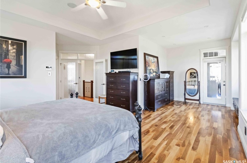 Bedroom featuring light wood-type flooring and ceiling fan