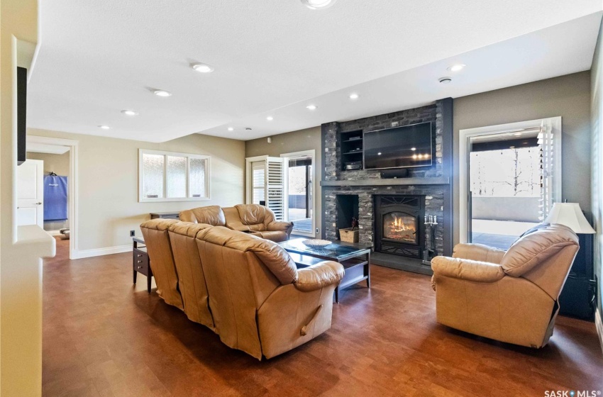 Living room featuring a fireplace and dark hardwood / wood-style floors