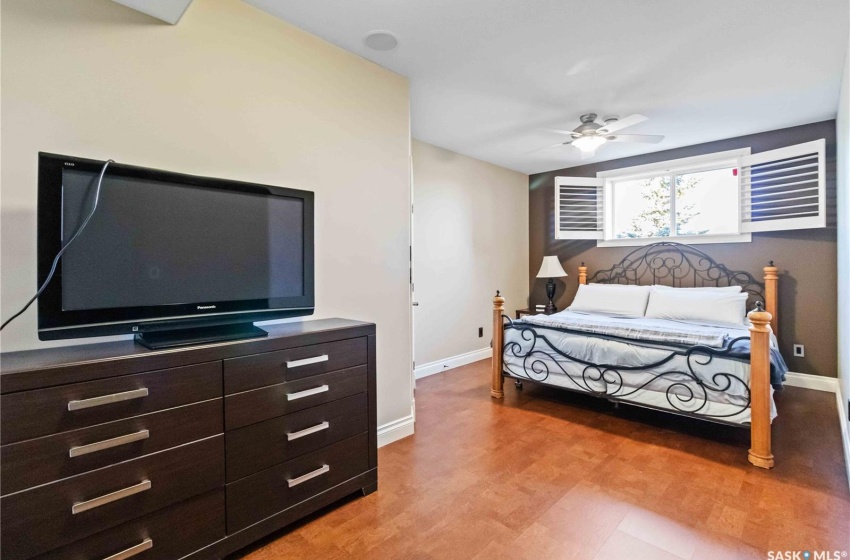 Bedroom with ceiling fan and light hardwood / wood-style floors