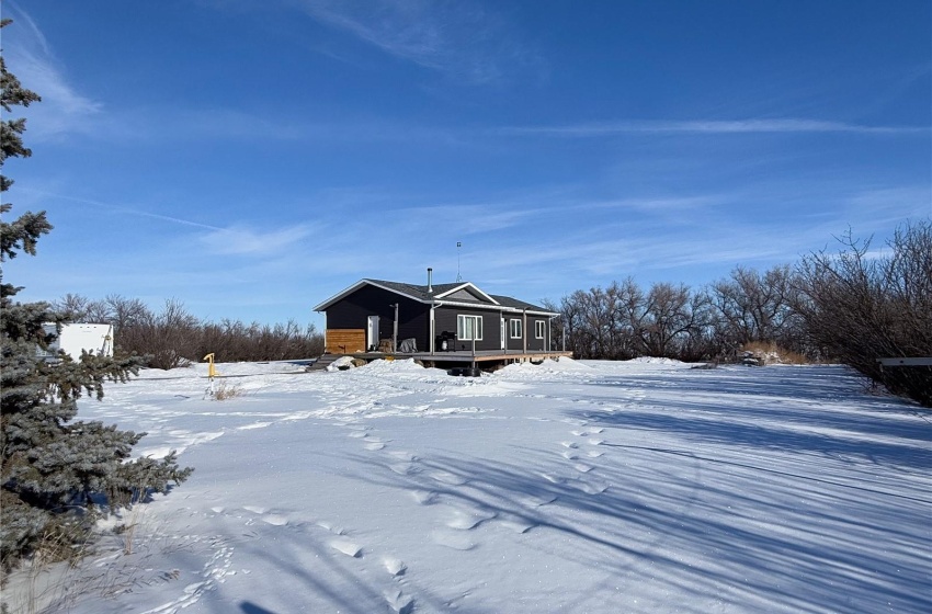 View of snow covered rear of property