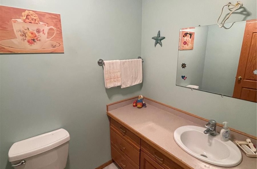 2 piece large bath with bidet next to main floor laundry