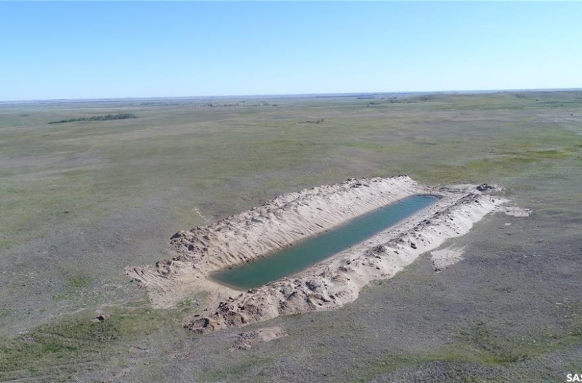 Birds eye view of property with a rural view and a water view