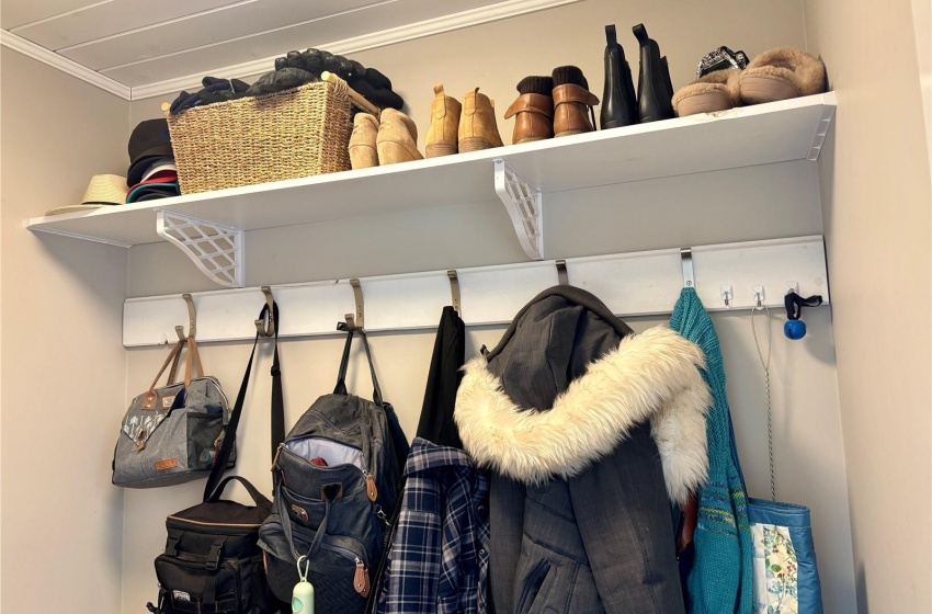 Mudroom featuring ornamental molding