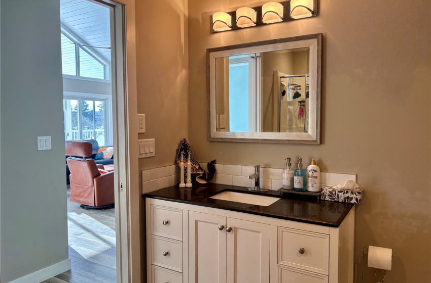 Bathroom with vanity and hardwood / wood-style floors