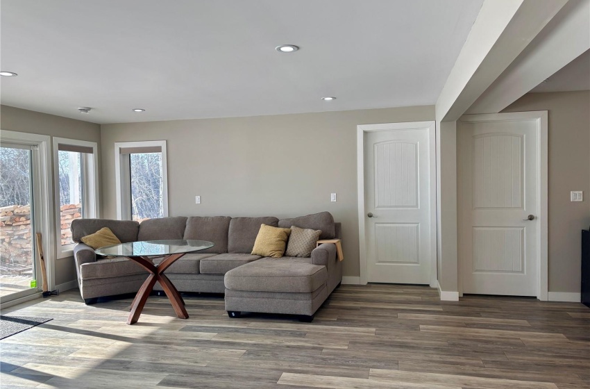 Basement family room featuring hardwood / wood-style flooring