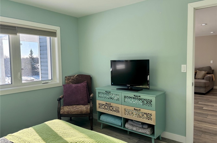 Bedroom with wood-type flooring