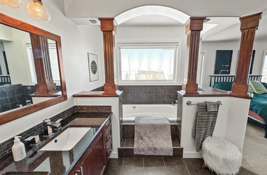 Double vanity with granite countertops.