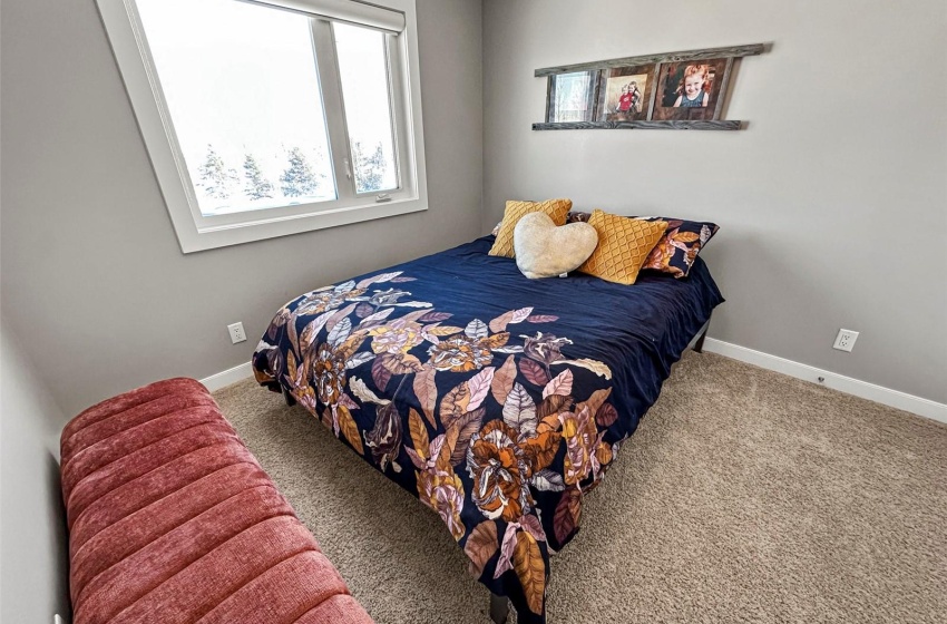 One of four bedrooms with a window to the east.