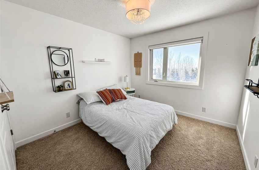 Bedroom with a window to the west.