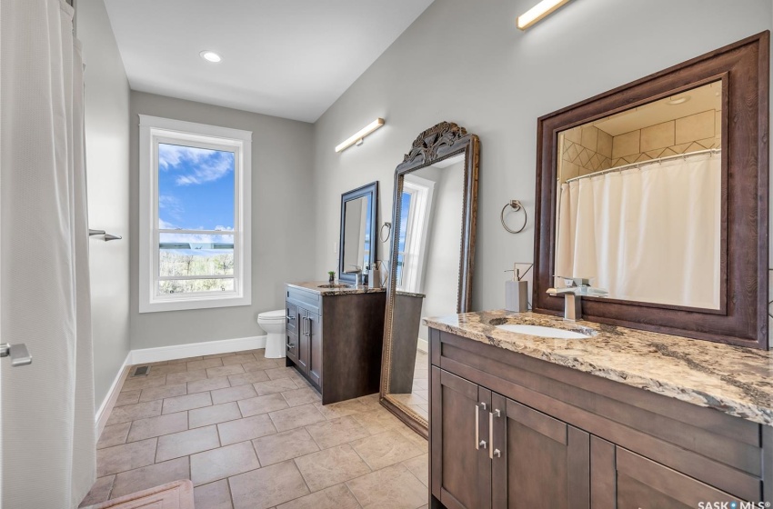 2nd floor bathroom with two vanities.