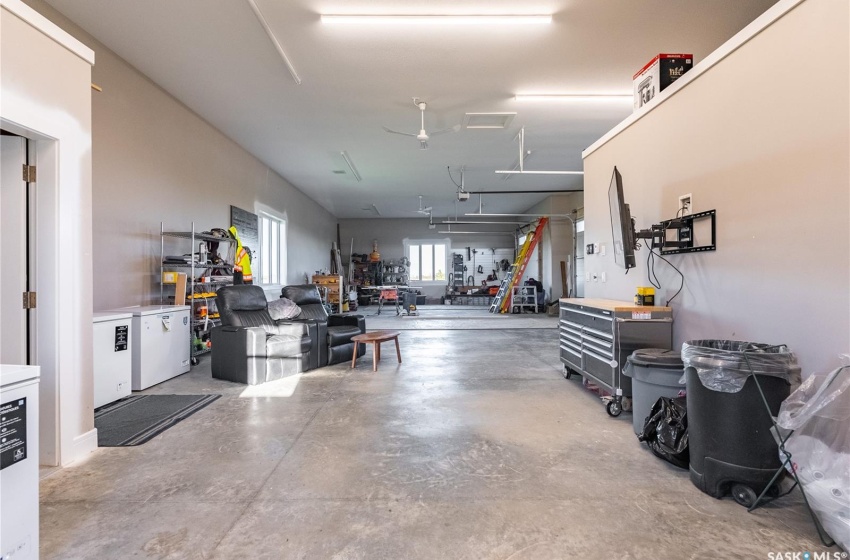 Man cave area in attached garage. There is a cold storage room and full 3-piece bathroom with shower.