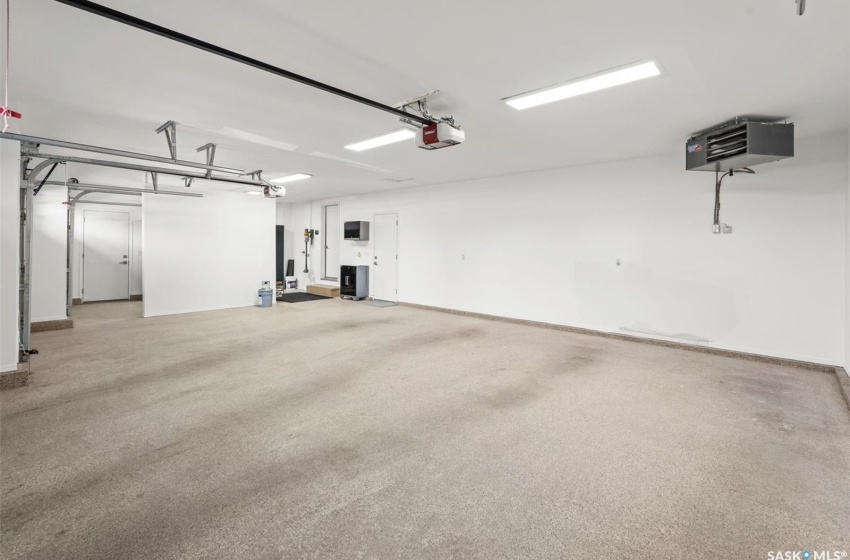 Garage with epoxy floors and a garage door opener