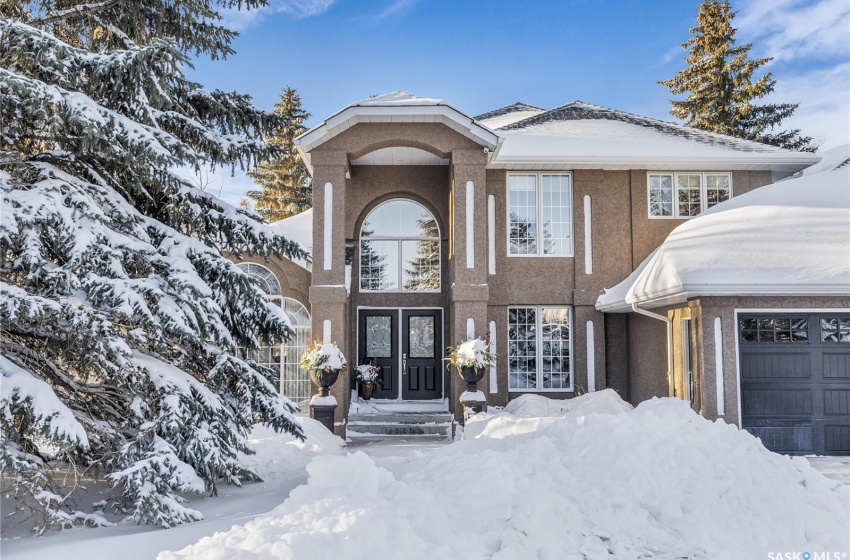 View of front of property featuring a garage and french doors