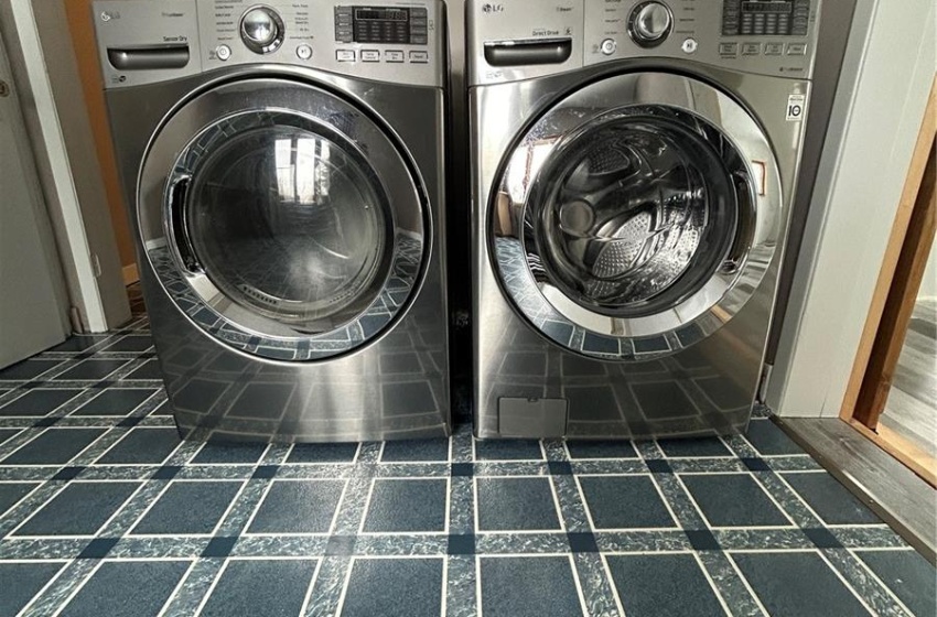 Laundry room featuring washer and clothes dryer