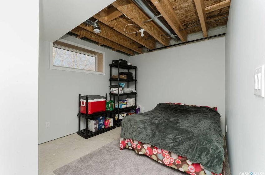 Bedroom featuring concrete flooring