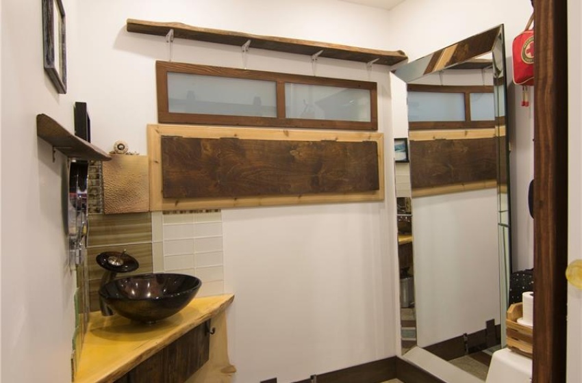 Bathroom with baseboards, toilet, and recessed lighting