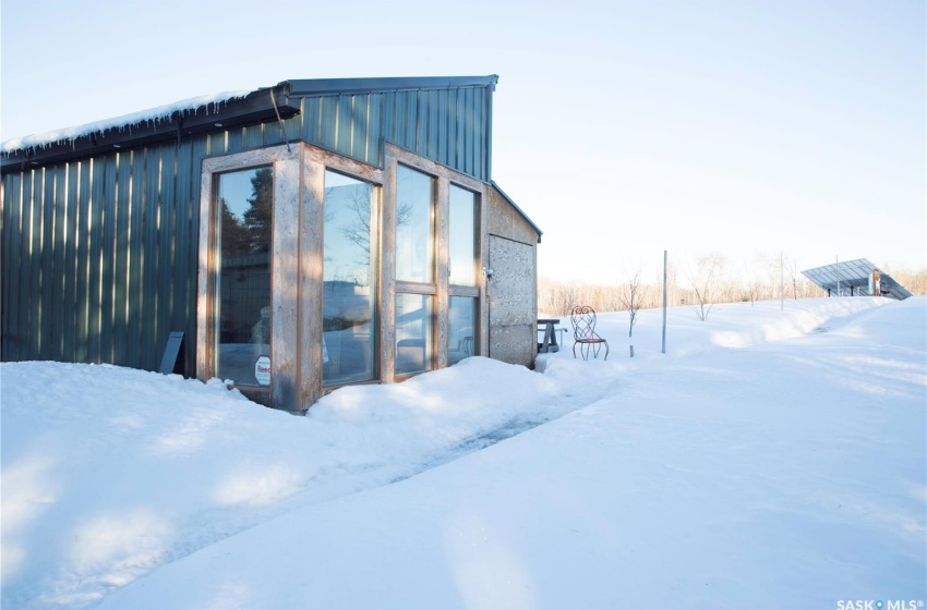 Snow covered structure with an outdoor structure